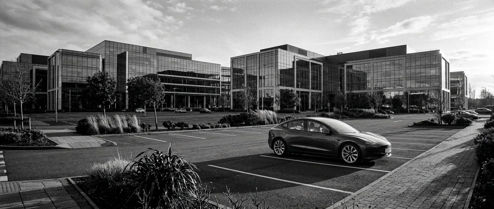 Electric car in an office park car park at Macquarie Park