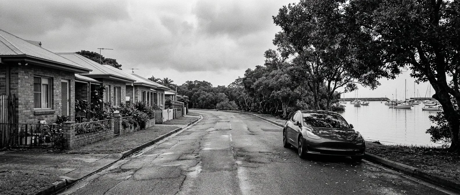 Electric car on a bayside street in the Redlands