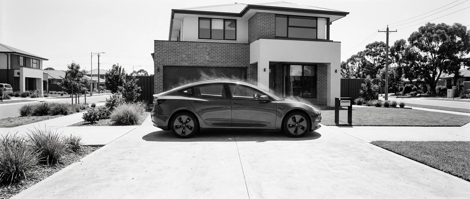 Electric car on an exposed driveway in the western Sydney heat