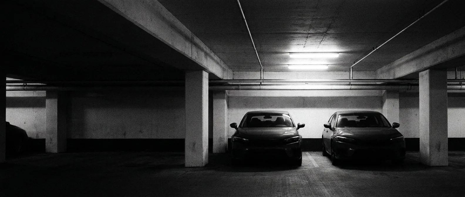 Two used electric sedans parked side by side for a used buyer comparison