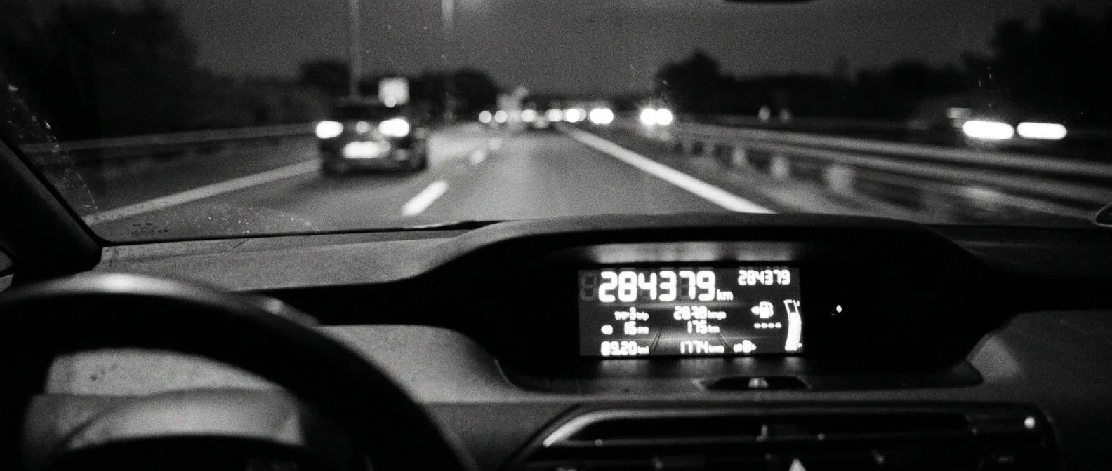 Instrument cluster of an electric car showing a high odometer reading