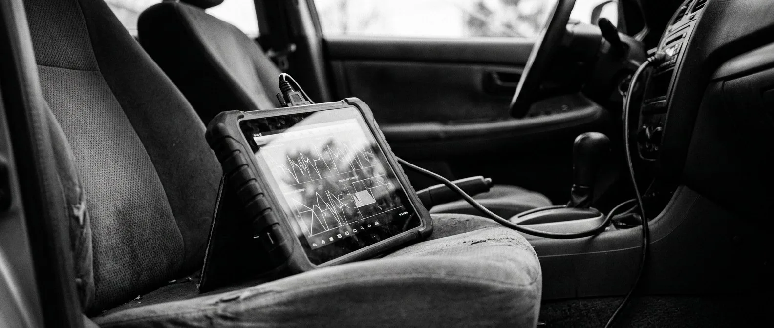 Diagnostic tablet reading battery cell data from an electric car